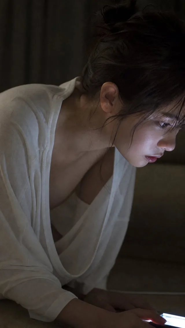 Moody Woman Looking at Phone preview image 1